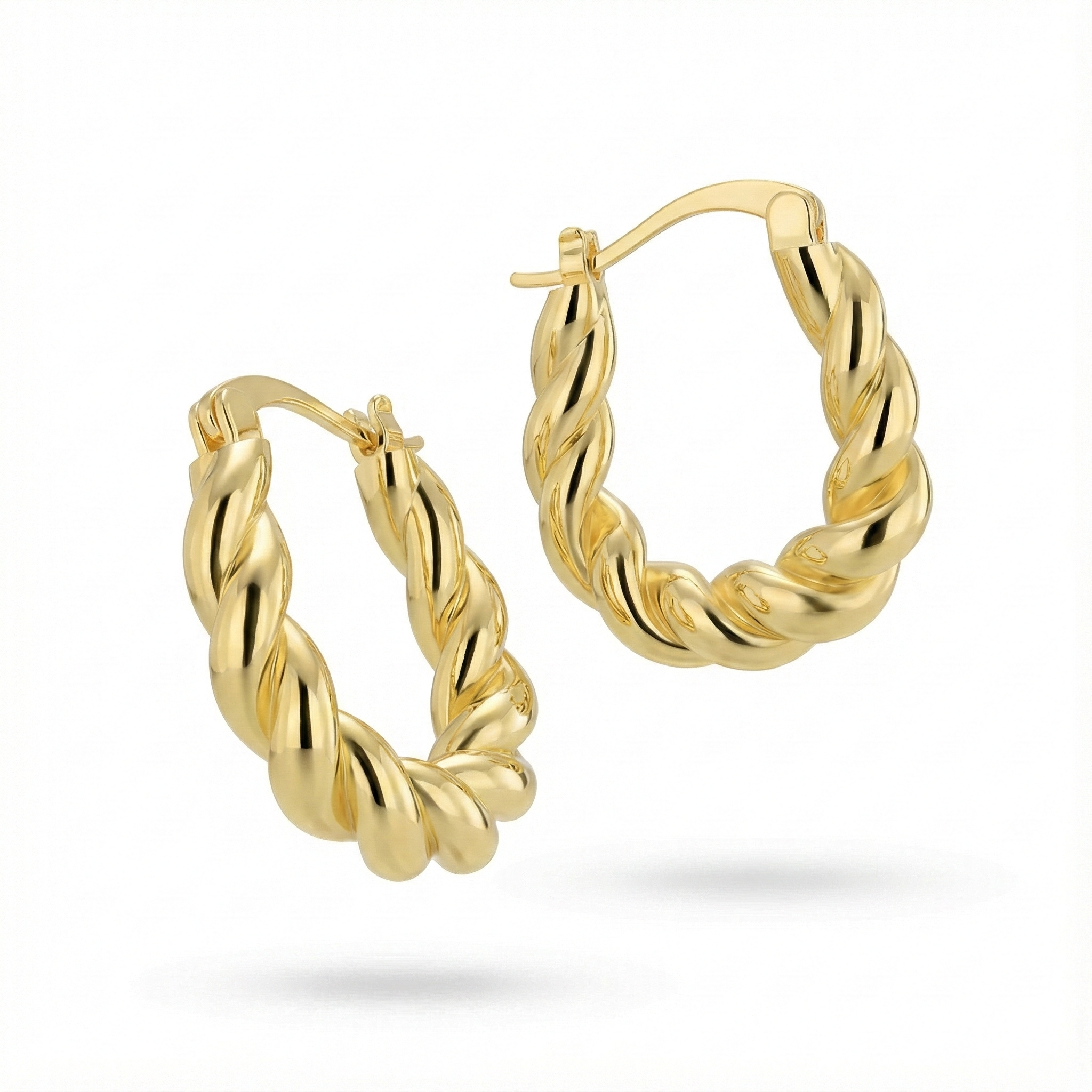 Créoles torsadées épaisses dorées or 18k à effet twist brillant, design sculptural et volumineux